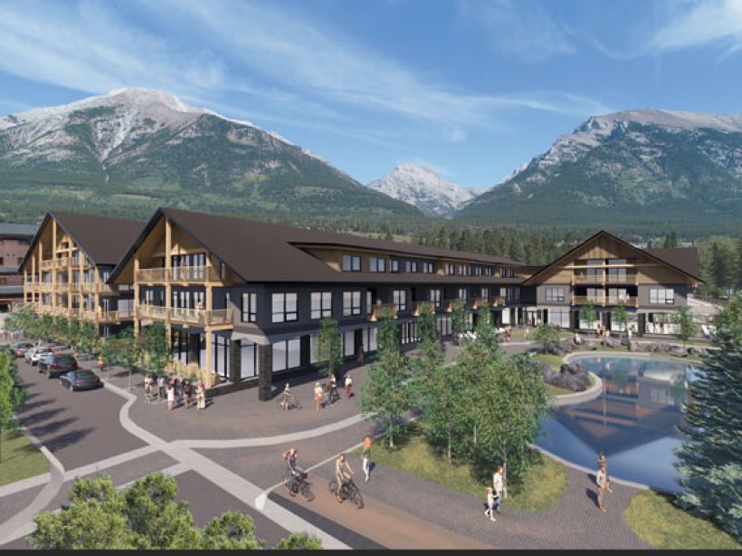 A rendered view of the Tamarack Lodge in Canmore, Alberta, with the Canadian Rockies in the background and the large feature pond in the forefront.