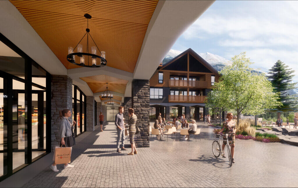 A rendered view of the Tamarack Lodge's open courtyard, with brick flooring, stone pillars, natural landscapes and lots of space for socializing.