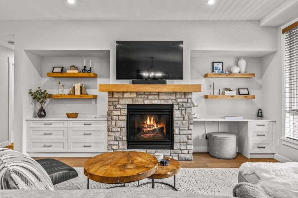 fire place in a living room with tv above it