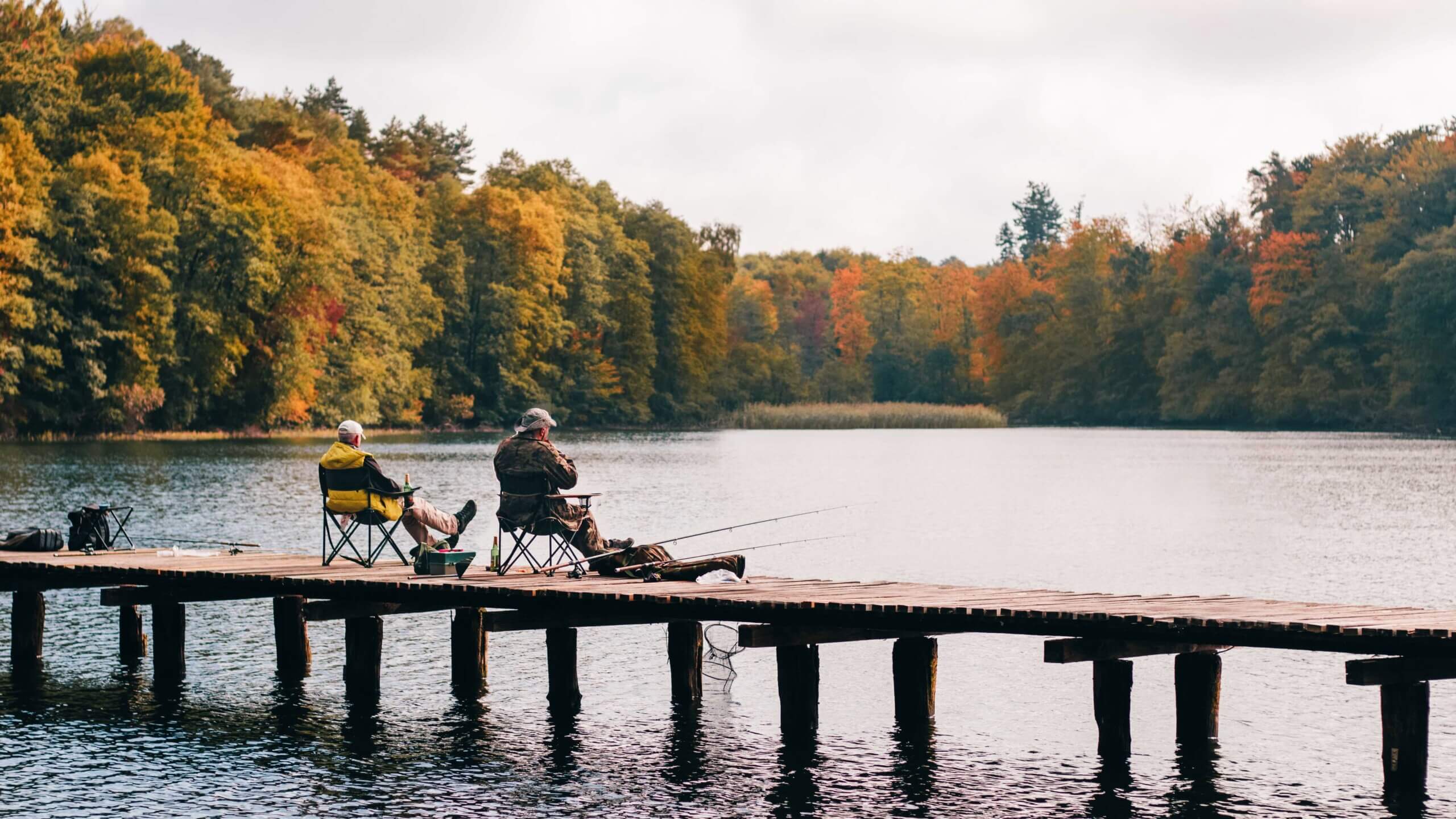 2 men fishing on a dock